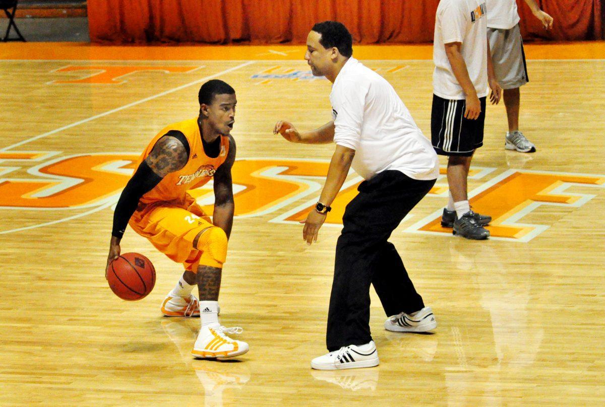 Josh Bone, senior guard, drives past assistant head coach Tony Jones at practice on Friday, Oct. 22. The Vols have been hard at work the past week getting geared up for the beginning of the season on Nov. 3 against Brevard.