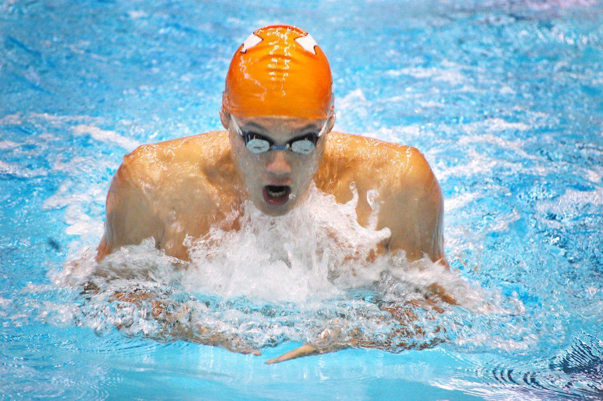 A UT swimmer powers ahead in the breaststroke during Tennessee's first dual meet of the season against Louisville on Thursday, Oct. 21. Tennessee won the meet with impressive performances from Norbert Kovacs, with three idividual wins, and Michael Wright, who set a new record in the one-meter springboard event at Allan Jones Intercollegiate Aquatic Center.