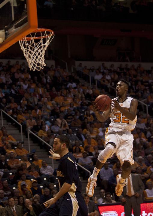 Scotty Hopson prepares to dunk over Chattanooga defender Omar Wattad on Friday, Nov. 12. Hopson was voted as MVP for the NIT Season Tip-off tournament as the Vols went on to win the championship in a 78-68 victory over Villanova.