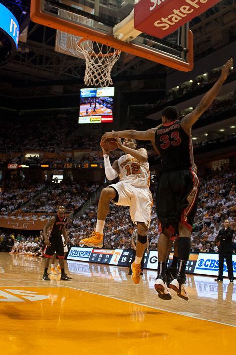 Tobias Harris drives to the basket, heavily guarded by Georgia's Trey Thompkins, on Saturday, Feb. 19. Despite powerful performances by Harris and Hopson, the Vols were unable to beat the Bulldogs a second time this season, falling 69-63 at home.