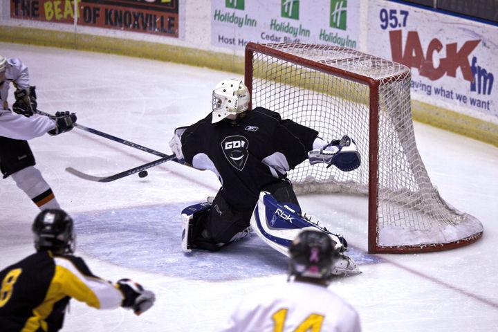 A goalie for the UT Ice Vols blocks a shot from the alumni team on Saturday, Feb. 5. The Ice Vols were able to end the home season in an exciting contest against the alumni which recognized the seniors and Coach Steve Durrigan.