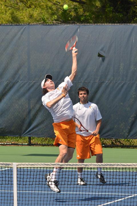 John-Patrick Smith jumps for an overhead as Boris Conkic watches on during a doubles match against Florida on Sunday, April 10. Following a disappointing loss at the SEC tournament, the Volunteers look to learn from their season heading into National Championship play.
