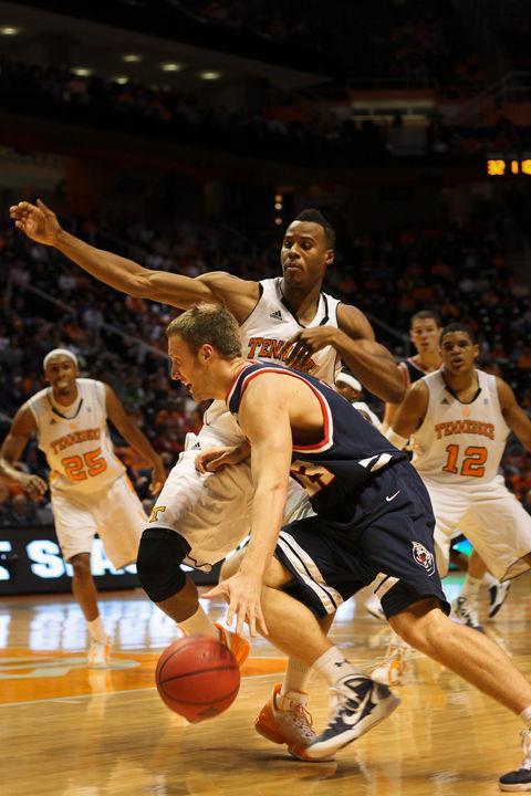 Renaldo Woolridge defends Belmont forward Jon House on Tuesday, Nov. 16, 2010. Woolridge discusses the importance of the Rocky Top League, which features many current and former UT players, to the fans.