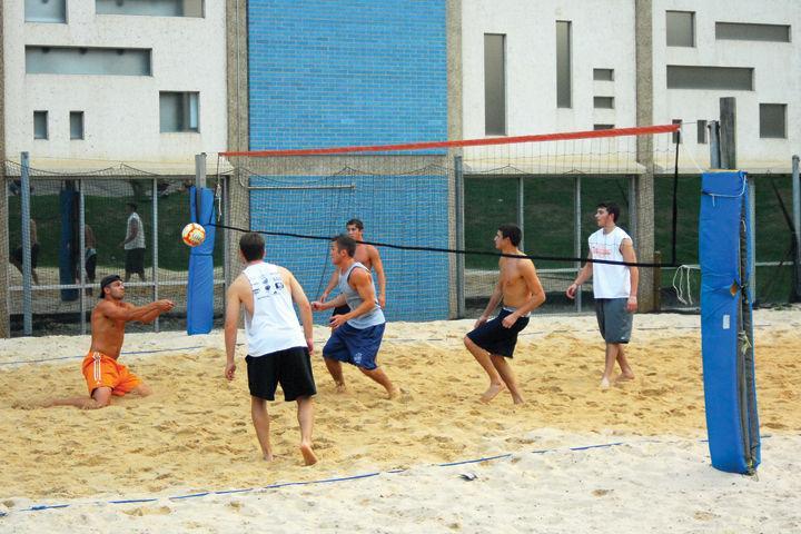 Students compete in an intramural volleyball game outside the SAC building on Saturday, July 9, 2005. Two of UT's intramural teams, the Paintball Club and the Wakeboarding Club, brought home two national championships from competition earlier this year.