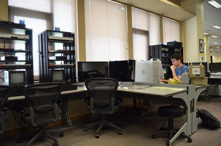 Curtis Wilkerson, sophomore in graphic design, works on a video project for his media arts class in the Studio in Hodges Library on Monday, July 25.