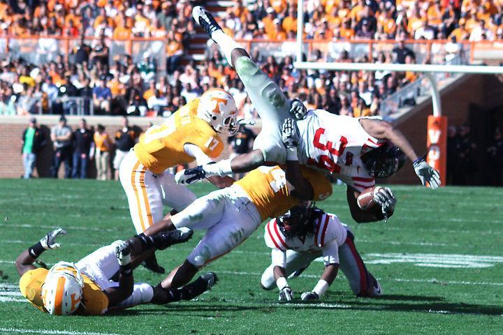 Herman Lathers prepares to slam a Mississippi ball carrier to the field during a game on Saturday, Nov. 13. Lathers opened up recently about the difficulties he's faced on and off the field, including his battle with bone cancer.