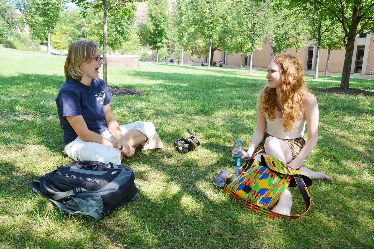 Samantha Holder, junior in religious studies, and Brittany Tipton, junior double majoring in global and religious studies, socialize outside Humanities on the first day of classes.
