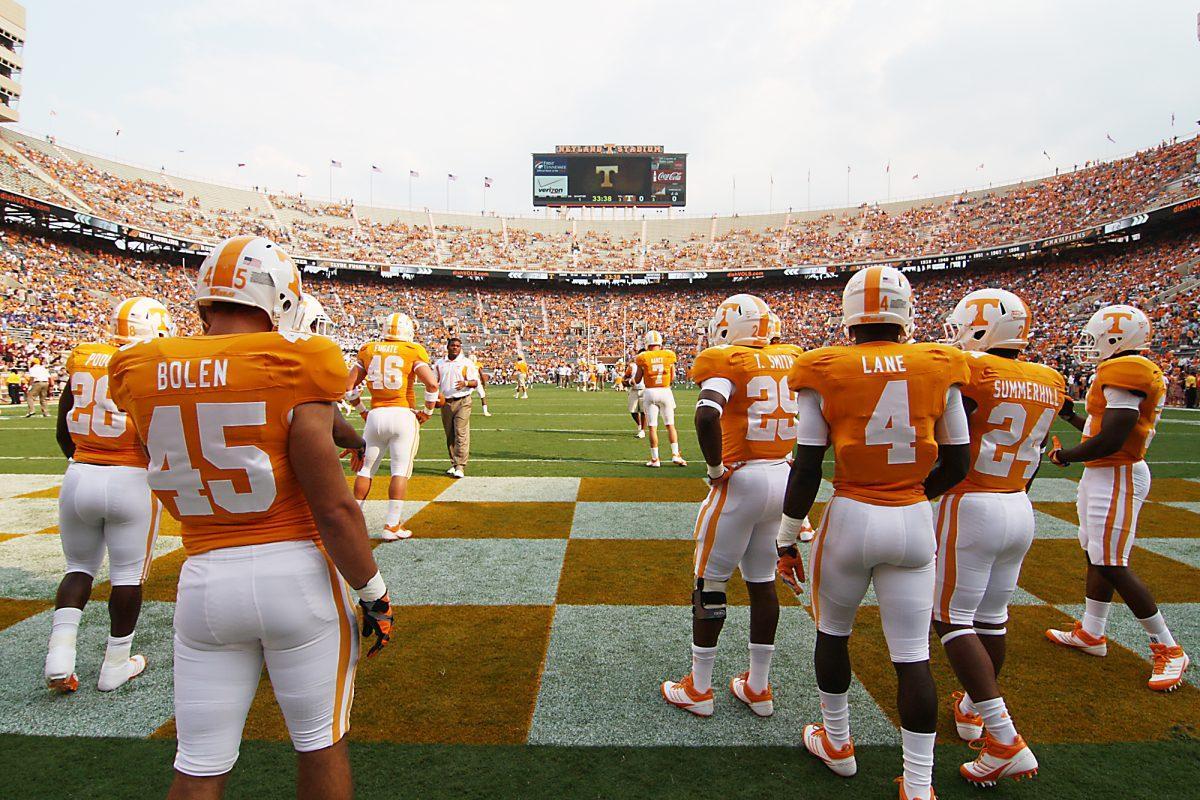 Players warm up before the Montana home-opener on Saturday. A storm came through Knoxville before the game started that made the Pride of the Southland walk off the field before the players could run through the Power “T.” The game finally started after a 93-minute delay.