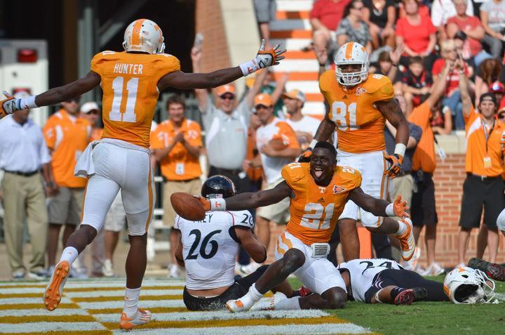 Da'Rick Rogers celebrates after losing his helmet during an amazing touchdown catch against Cincinnati on Saturday, Sept. 10. Tyler Bray threw for a career-high 405 yards as the Vols' receiving corps settled into stride in the second game of the year.