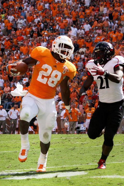 Tauren Poole runs past a Cincinnati defender during a game in Neyland Stadium on Saturday, Sept. 10. Poole looks to remain focused on the Vols' upcoming game against Buffalo and not get lulled into a false sense of security against the Bulls, who have faired poorly in previous years.
