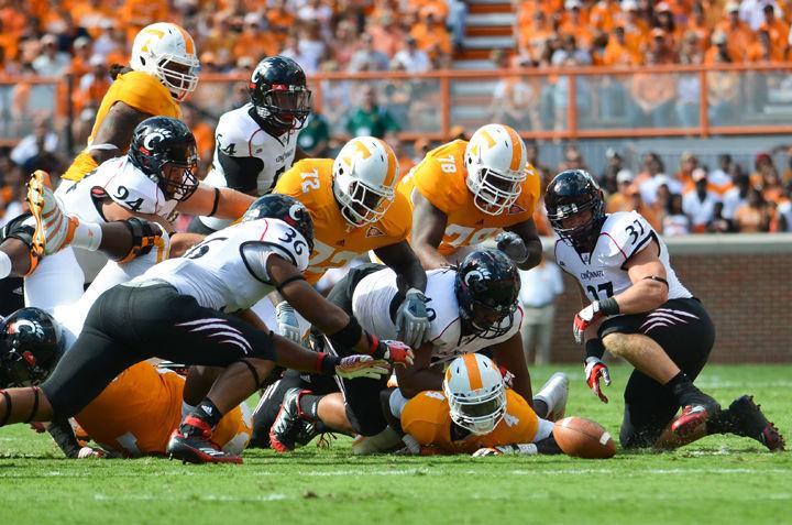 Marlin Lane Jr. watches as a ball he fumbled is recovered by Cincinnati players during a game on Saturday, Sept. 10. The Vols have been plagued with second half woes this season, being outscored 51-23 over three losses.
