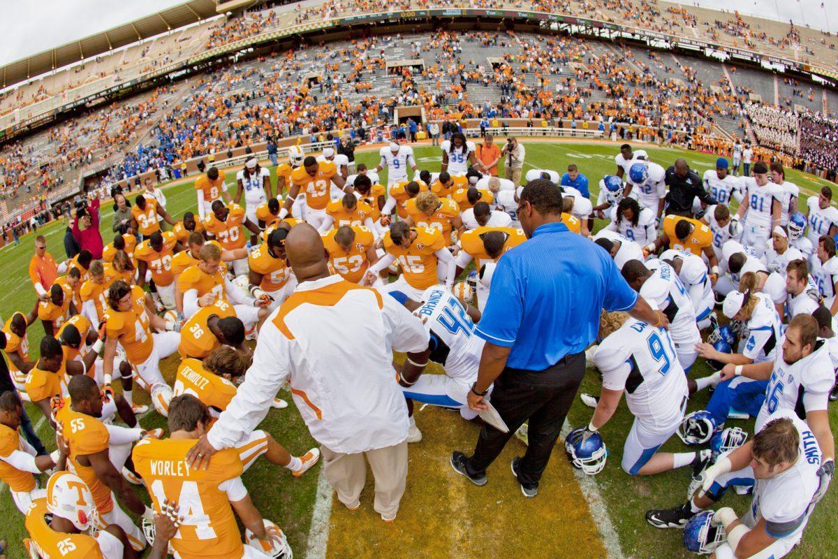 Roger Woods, the Vols’ football chaplain, helps lead a midfield prayer after the football game against Buffalo on Oct. 1. Woods helped lead Gametime in Tennessee, a concert that was held in Neyland Stadium in May.