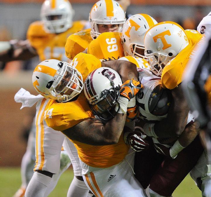 Maurice Couch and a host of Vols haul down a South Carolina player during a game on Saturday, Oct. 29. Despite multiple forced turnovers by the defense, the offense couldn't capitalize, producing only three points from four trips inside the South Carolina 30-yard line and falling 14-3 to the Gamecocks.