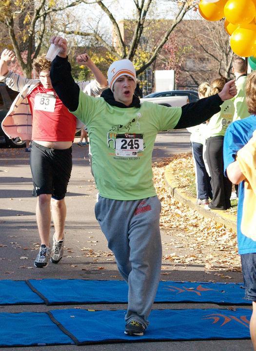 Mark Newman, undecided sophomore, crosses the finish line during the Running with Hope 5k in Circle Park on Saturday, Nov. 12. The YWCA Knoxville will be holding its annual Race against Racism on Jan. 14, starting at the YWCA Phyllis Wheatley Center.