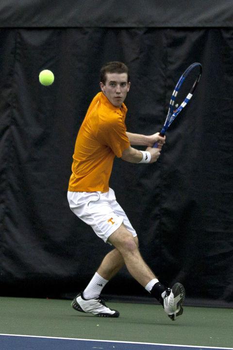????Brandon Fickey lines up a shot against a Michigan State player during a match on Jan. 29. Fickey looks to bring intensity to the team in his freshman year, playing in the No. 2 spot in both lineups.