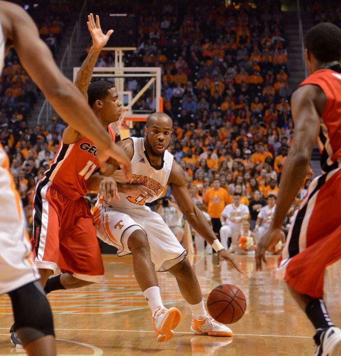 Trae Golden looks for a lane between defenders during a game against Georgia on Saturday, Feb. 4. Golden led the game with 16 points to help the Volunteers in a home win over Georgia, 73-62.