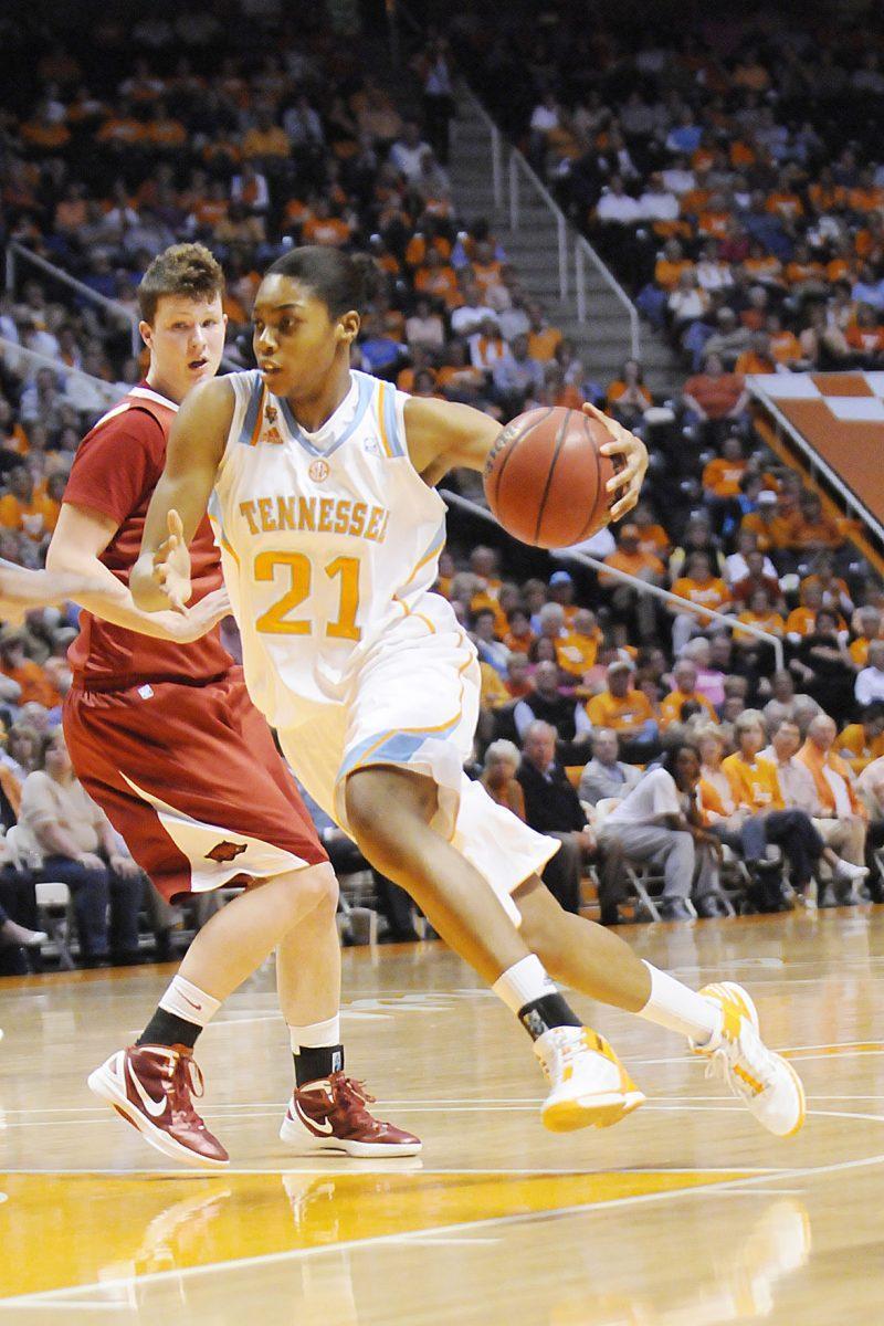 Forward Vicki Baugh rushes past a Razorback defender on Feb. 23. Baugh averages 7.8 points a game for the Lady Vols.