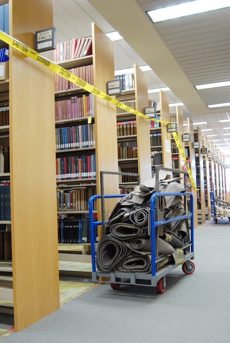 Old carpet from between the stacks waits to be moved during construction in summer 2010. More construction is to continue on the second floor in the Commons, Starbucks and the Studio this summer.