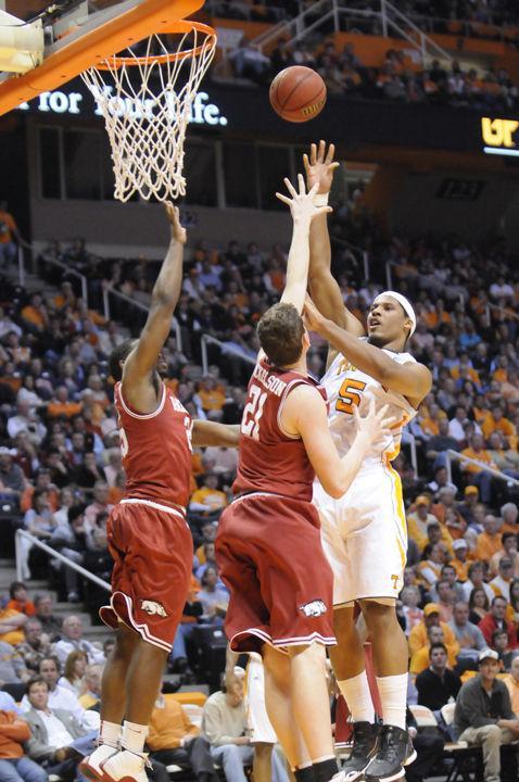 Jarnell Stokes shoots over two Arkansas defenders during a game on Wednesday, Feb. 15.
