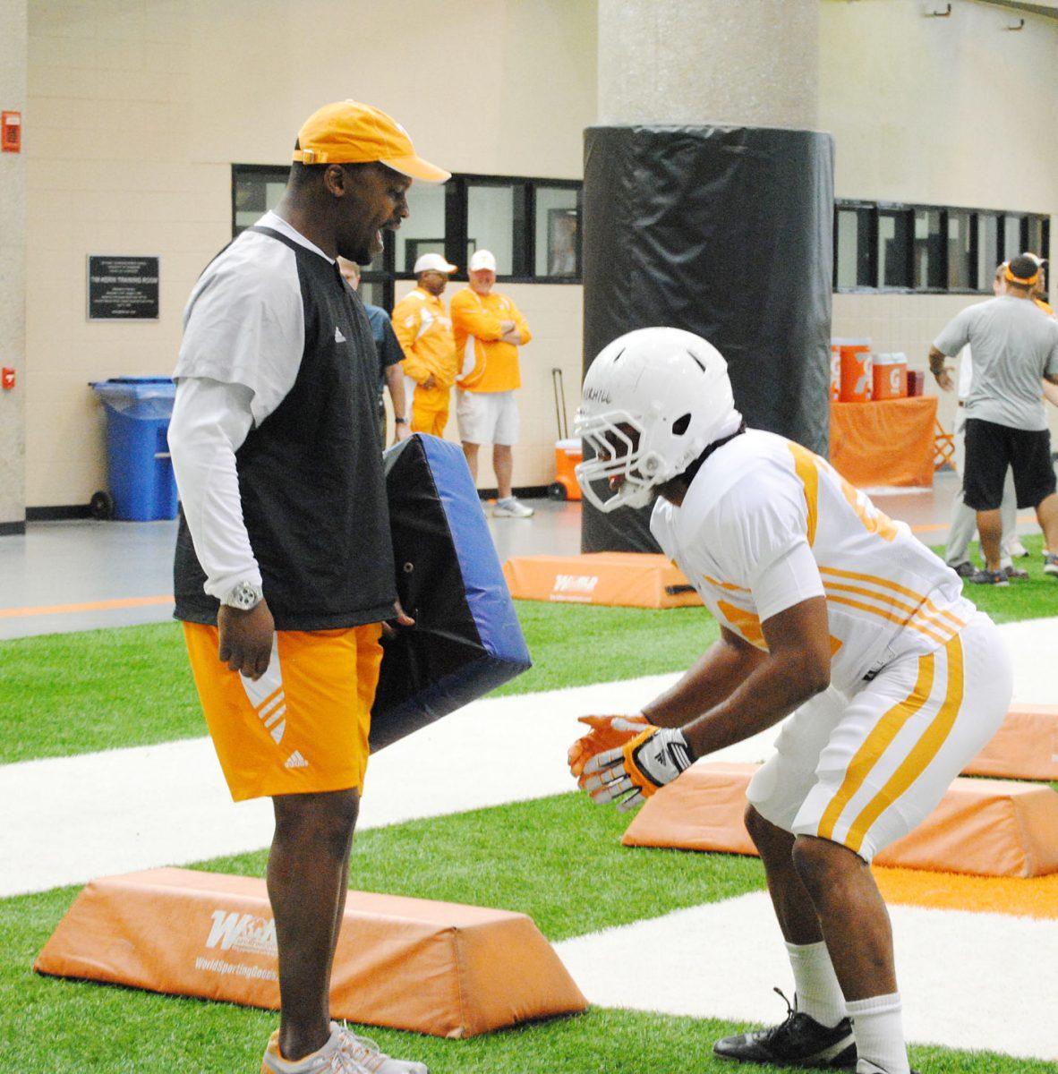 Running backs coach Jay Graham yells during spring practice on April 3. Graham is trying to challenge his players to capitalize on opportunities.