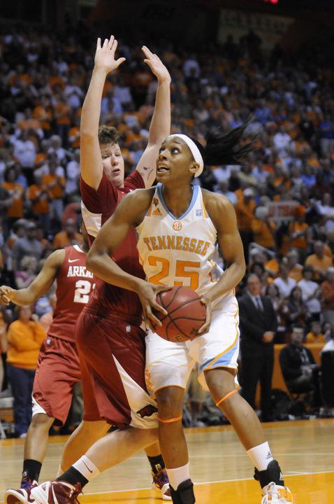 Glory Johnson looks beyond a defender before a shot during a game against Arkansas on Feb. 23. Johnson excelled not only on the court during her four years at UT, but also in the classroom, where she was named a member of the Academic All-American First Team.