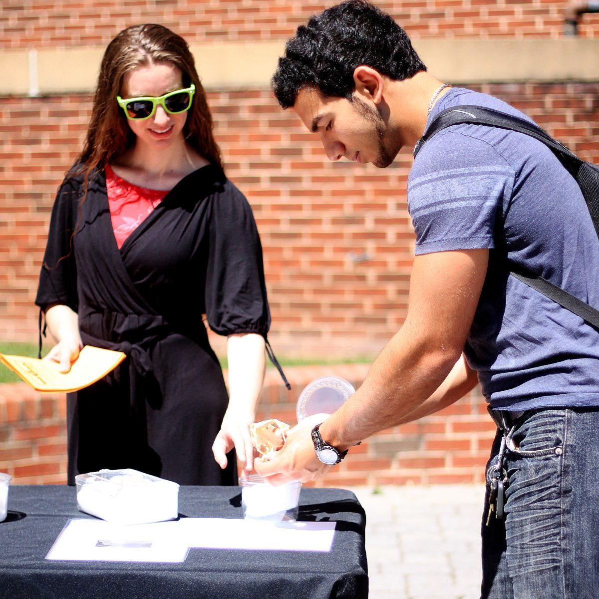 Seena Beztchi, junior in industrial engineering and a current Vols Teach student, plays with a skull at the VolsTeach table on April 12.
