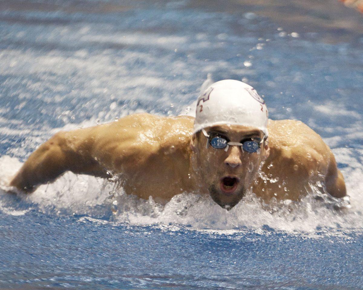 Michael Phelps perfects his butterfly stroke at Allan Jones Aquatic Center Thursday. Phelps and the rest of the US Olympic swim team have practiced on-campus for the past week.