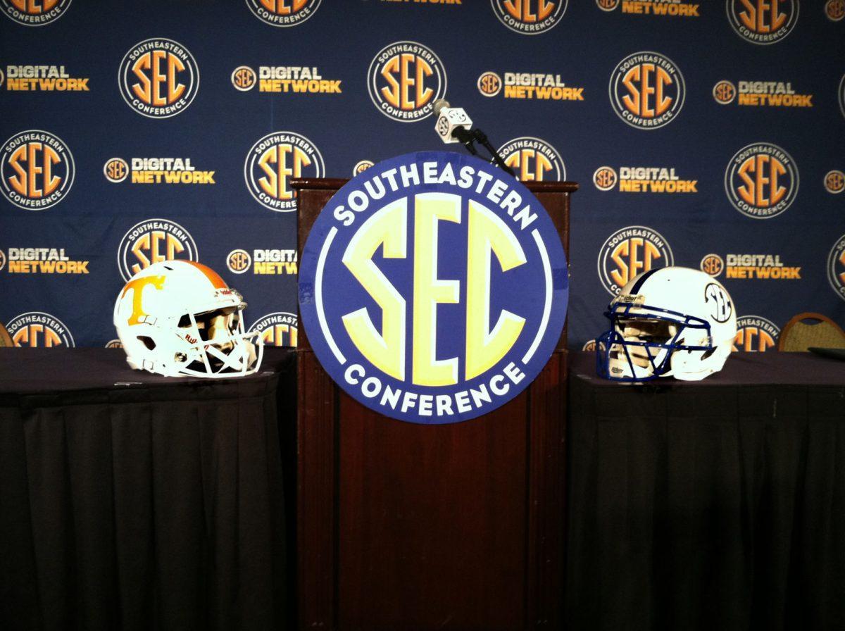 A Tennessee and SEC helmet sit next to the podium where Derek Dooley spoke to the media on July 19.
