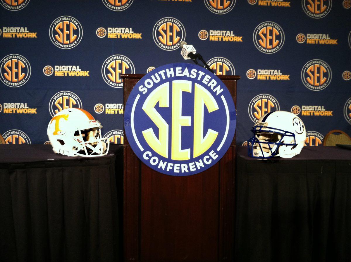 A Tennessee and SEC helmet sit next to the podium where Derek Dooley spoke to the media on July 19.