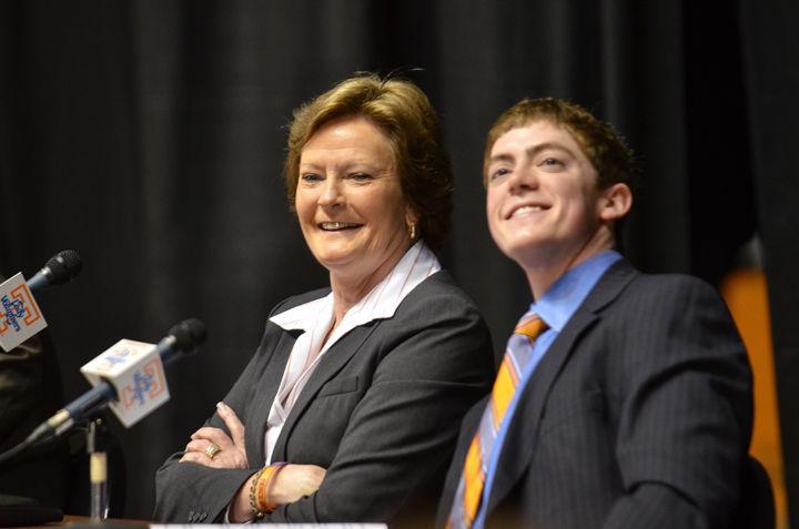 Tyler Summitt smiles beside his mother, Pat Summitt, at her April 19 retirement press conference.