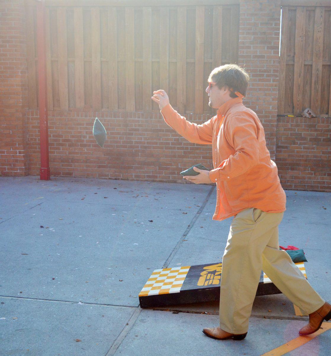 Sean Sullivan, junior in journalism and electronic media, plays cornhole before the Vandy game on Nov. 19, 2011.