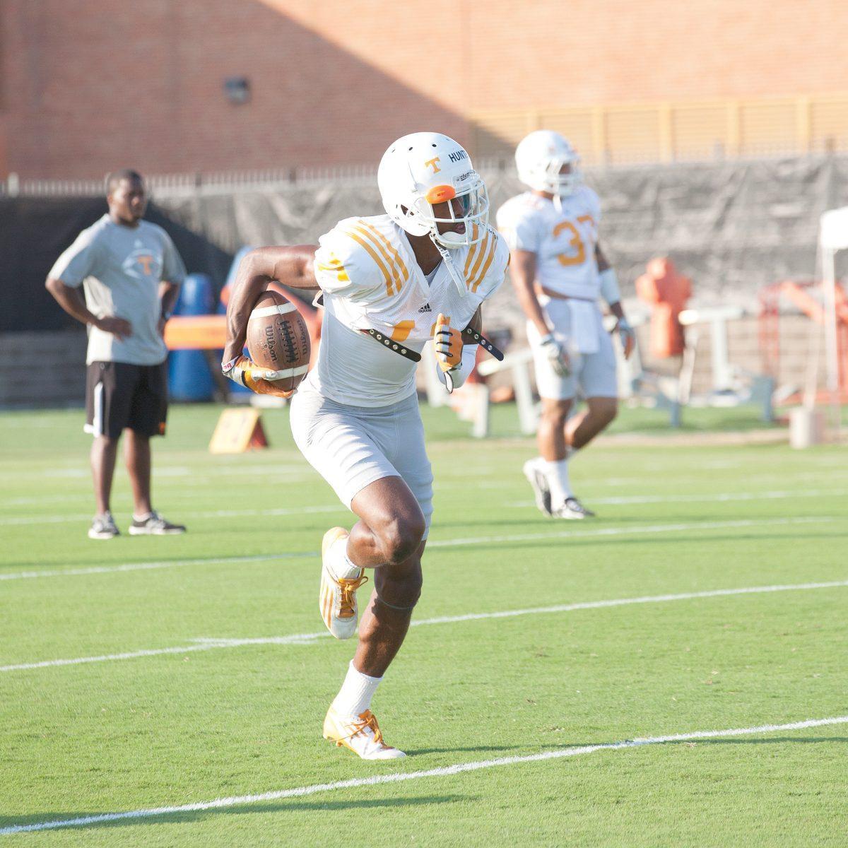 Justin Hunter runs with the football during football practice on August 26. Justin Hunter will return this season to encounter North Carolina State in Tennessee's season opener on Friday August 31.