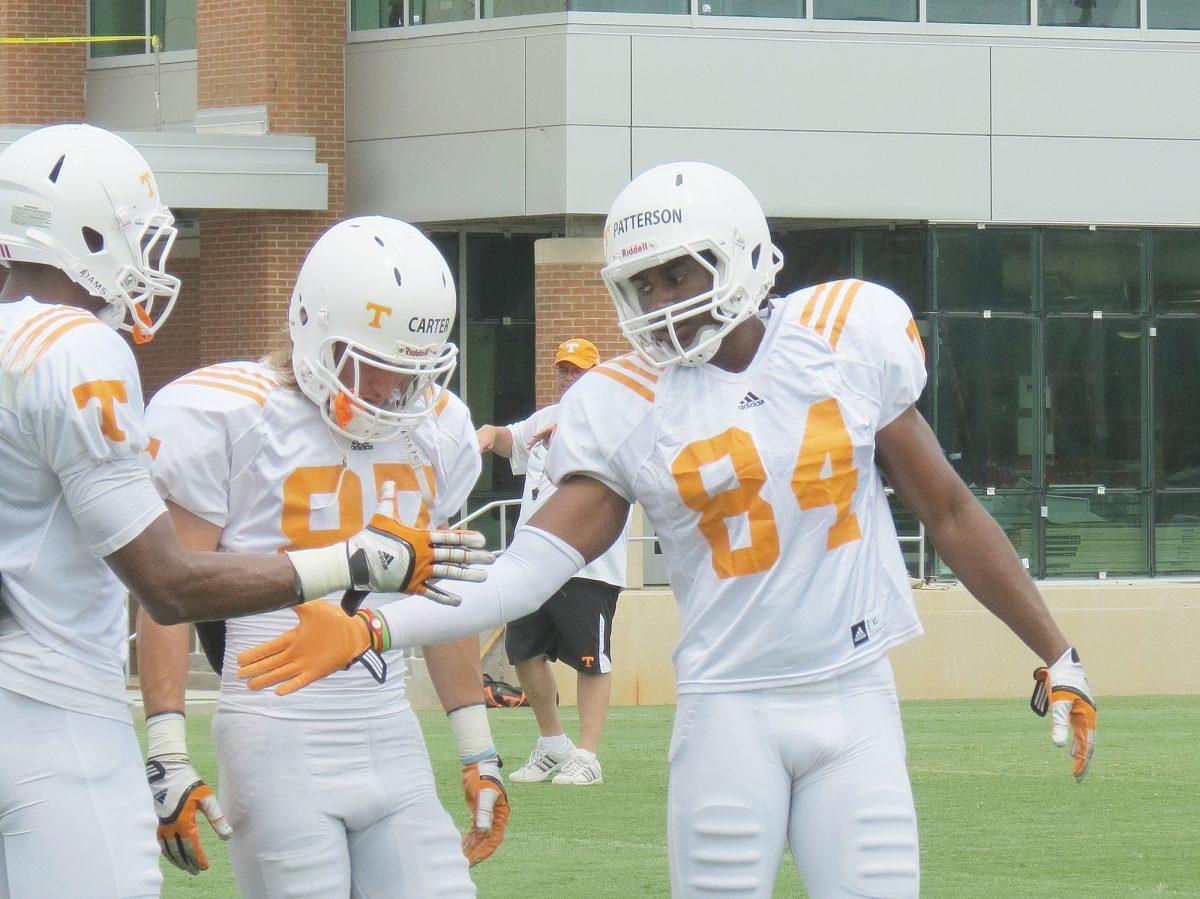 Cordarrella Patternson gives a high five during summer practice