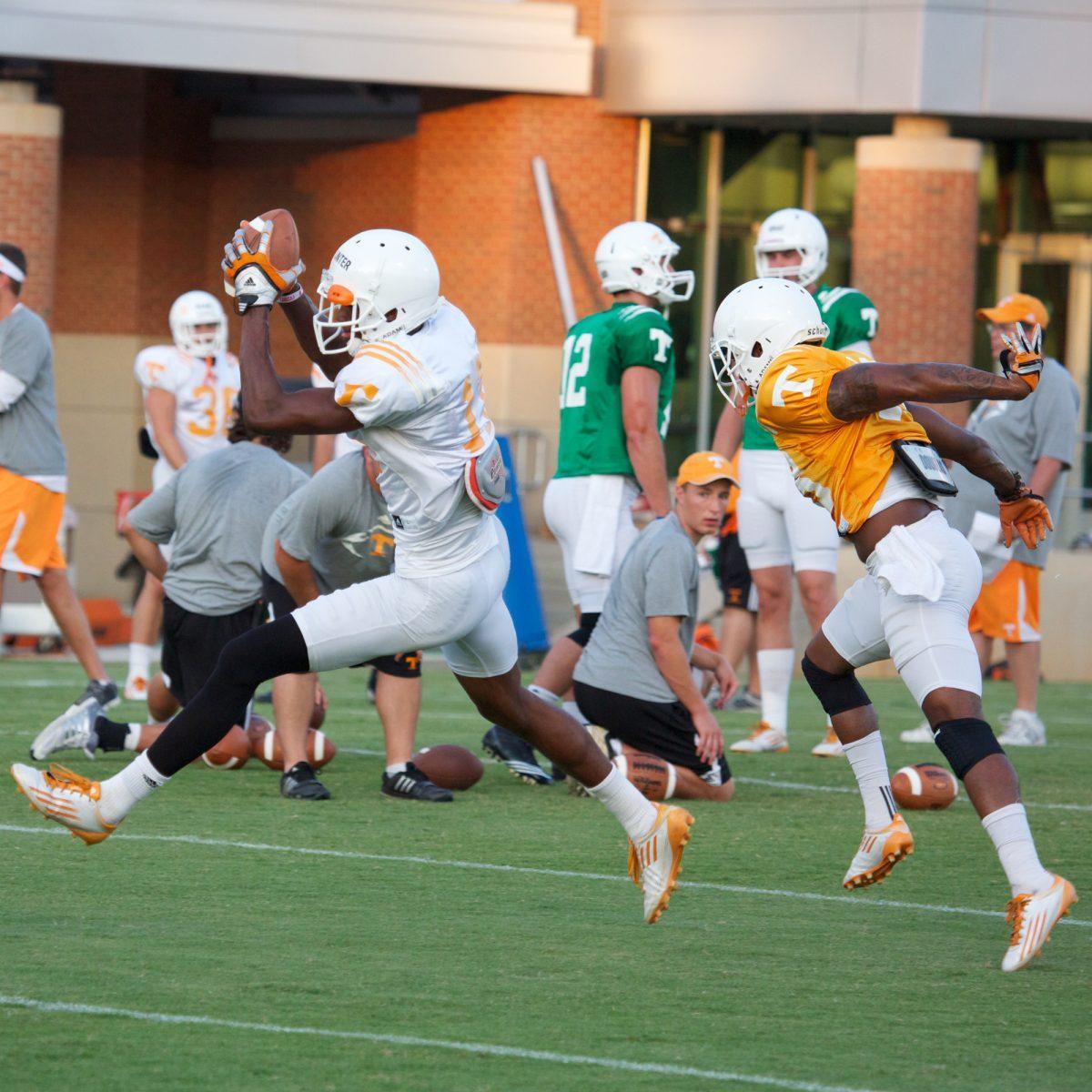 Justin Hunter streaks past a defender in a drill during practice Aug. 8.