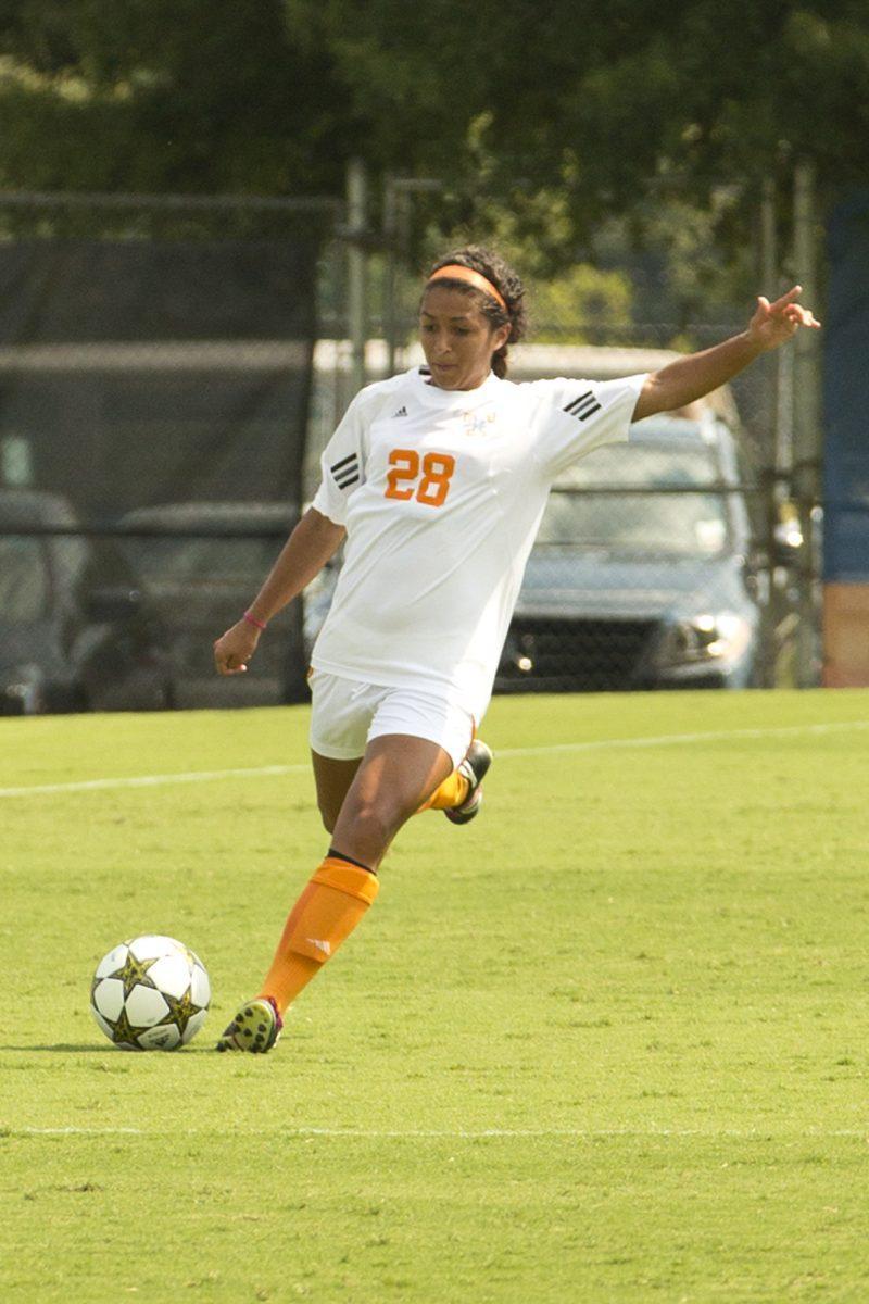 Sophomore Brittney Wade kicks the ball during the game against VCU on Aug. 26.