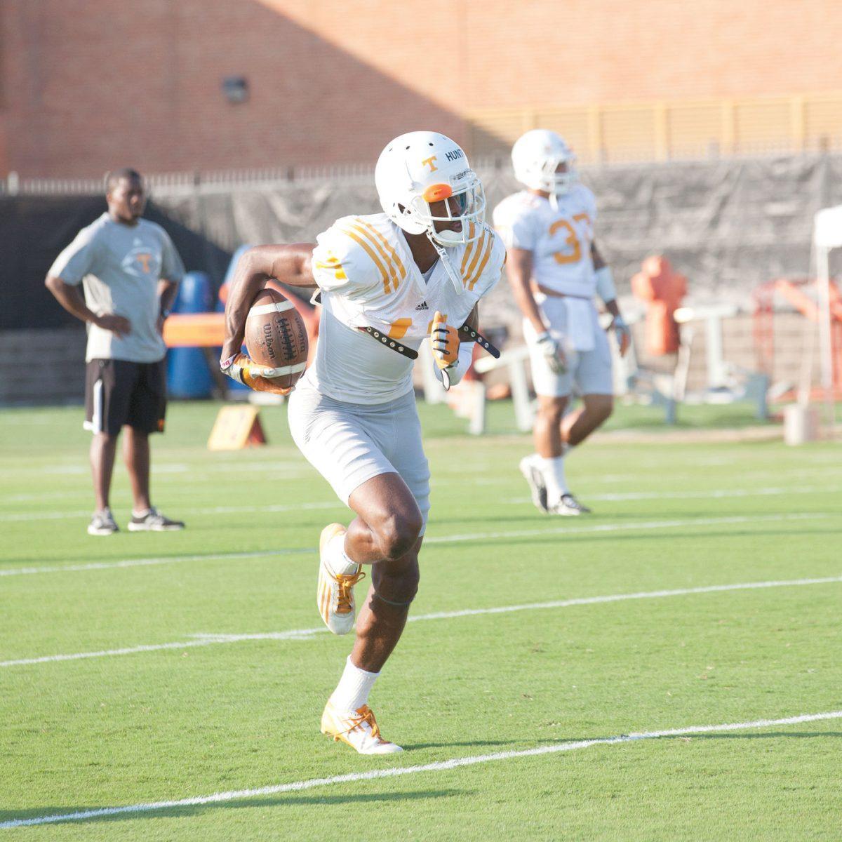 Justin Hunter runs with the football during football practice on August 26. Justin Hunter will return this season to encounter North Carolina State in Tennessee's season opener on Friday August 31.