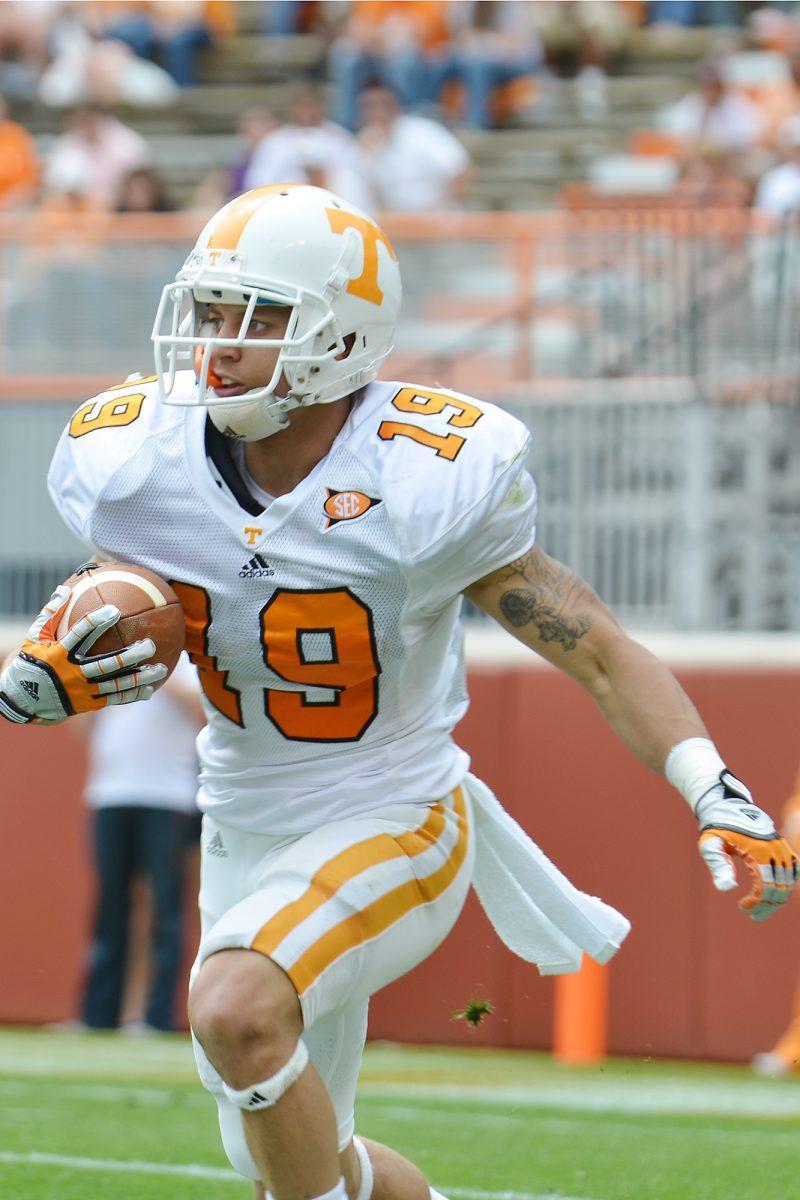 Tailback Devrin Young returns the ball during the Orange and White game on April 21.