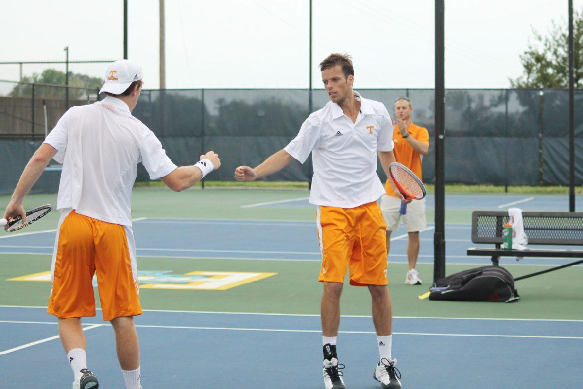 Jarryd Chaplin and Edward Jones celebrate a point during a match against Vanderbilt on March 30.