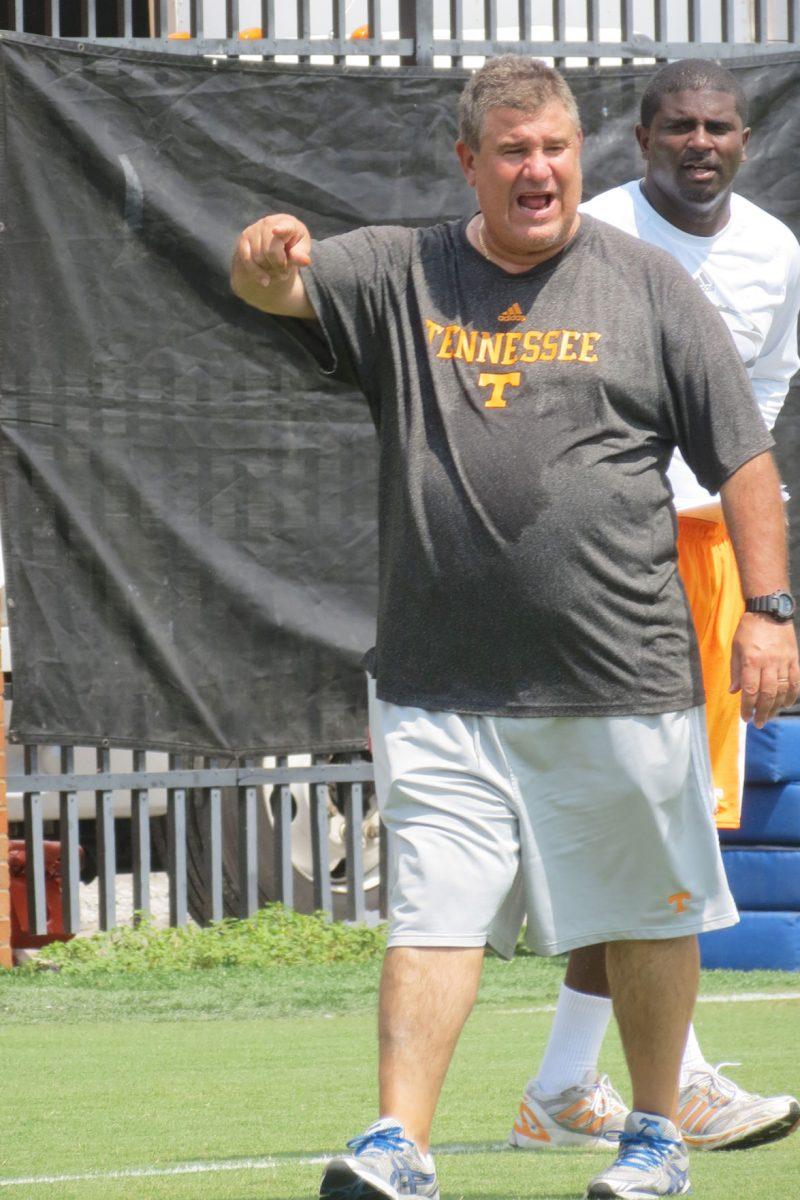 Defensive coordinator Sal Sunseri yells at the players during practice on July 28.