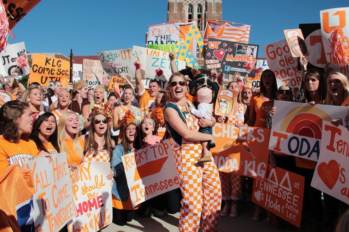 “Today Show” correspondent Sarah Haines holds a young UT fan during the filming of “Kathie Lee and Hoda” show on Sept. 19.