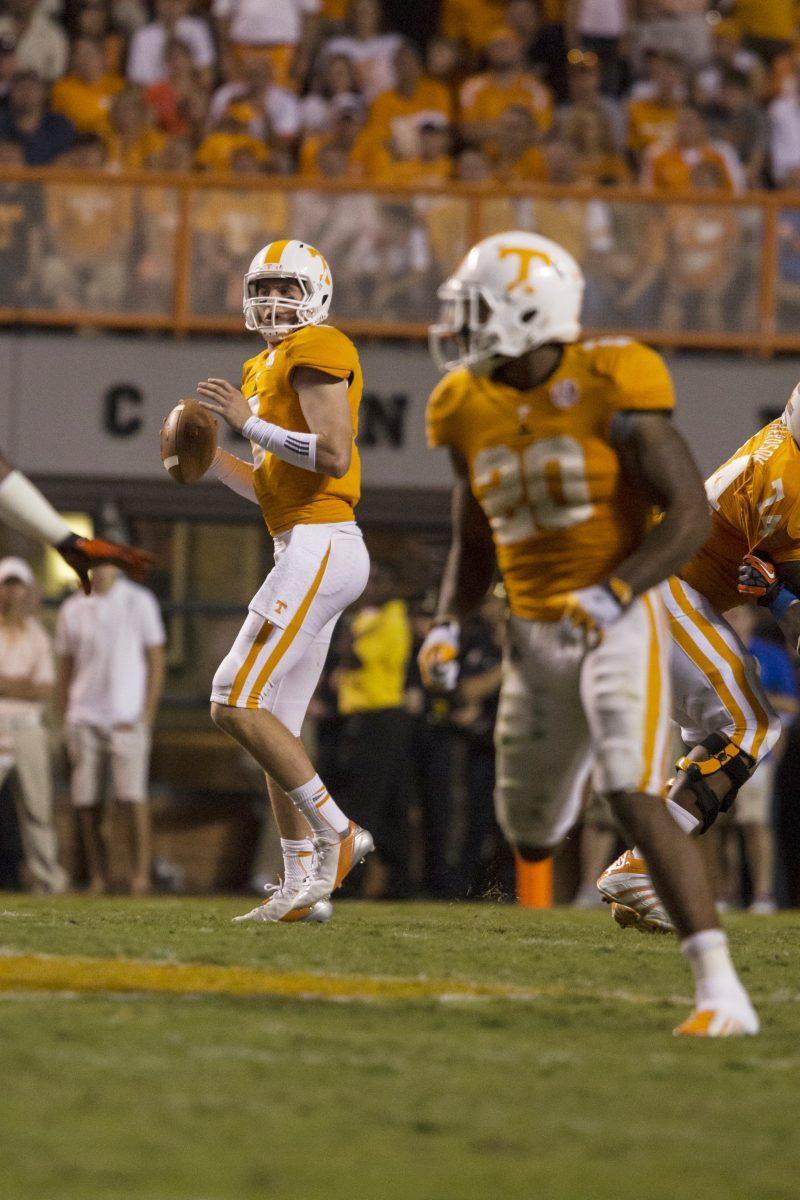 Junior quarterback Tyler Bray looks down field for a pass during the Florida game on Sept. 15. Bray threw for 401 yards and four touchdowns for a career-high against Akron on Sept. 21.