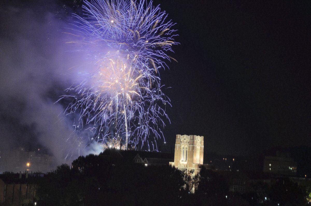 Fireworks explode over the Tennessee River behind Ayers Hall as viewed from the roof of Volunteer Hall on Sept. 2.
