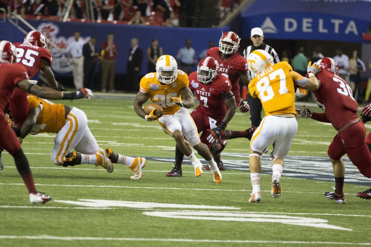 Rajion Neal streaks up the field during the North Carolina State game on Friday, Aug 20. Neal carried the ball 22 times for 53 yards.