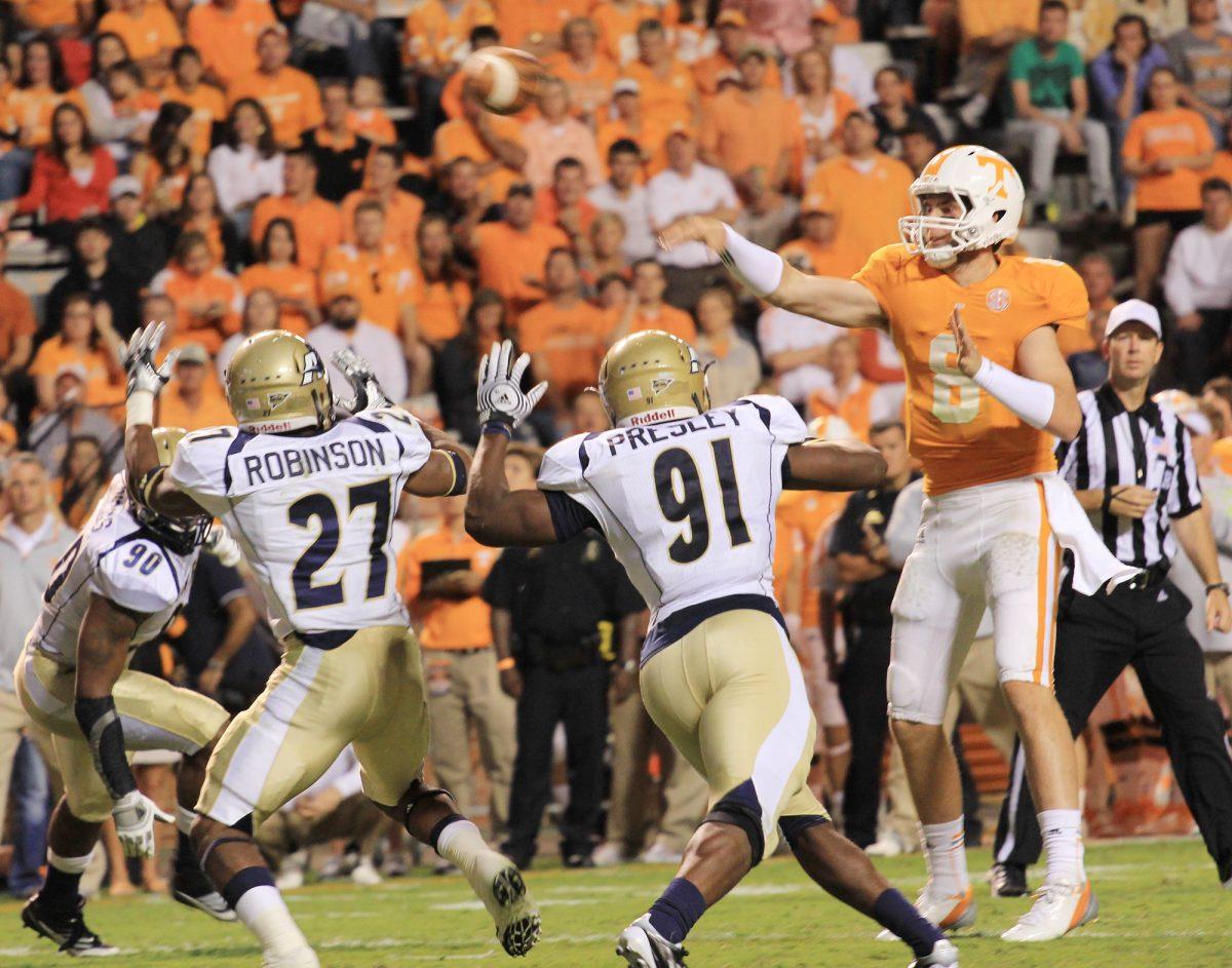 Tyler Bray throws the ball over Akron defenders on Sept. 22.