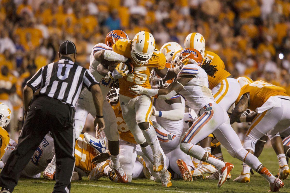 A.J. Johnson fights for extra yards on a fourth and 1 carry against the Gators on Sept. 15.