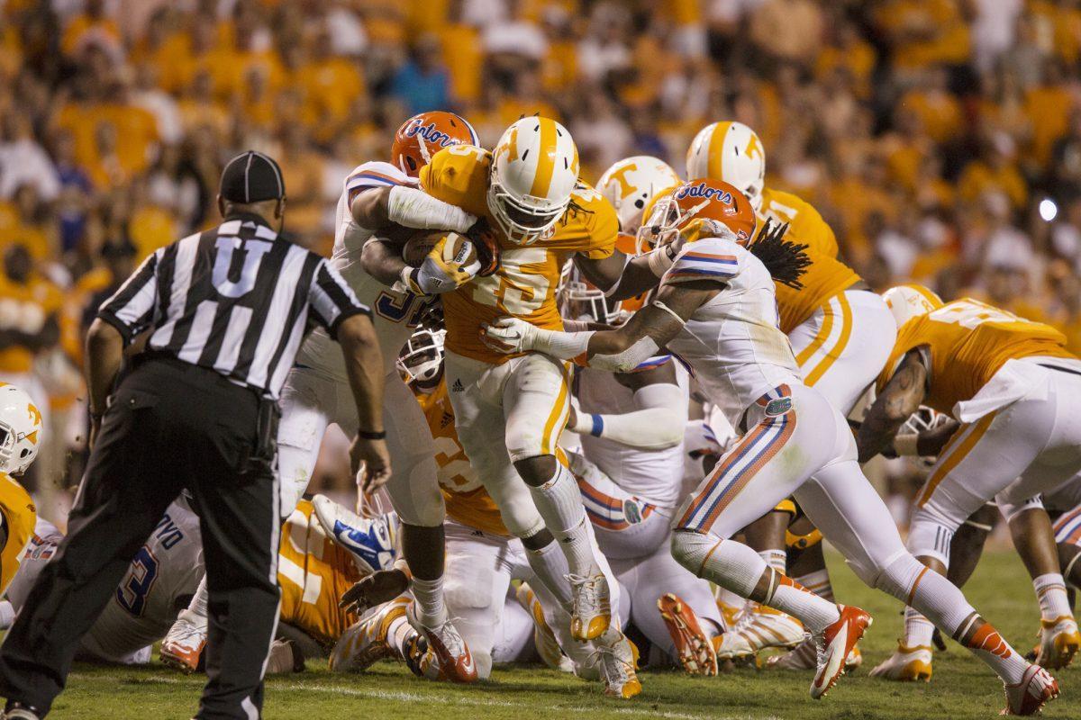 A.J. Johnson fights for extra yards on a fourth and 1 carry against the Gators on Sept. 15.