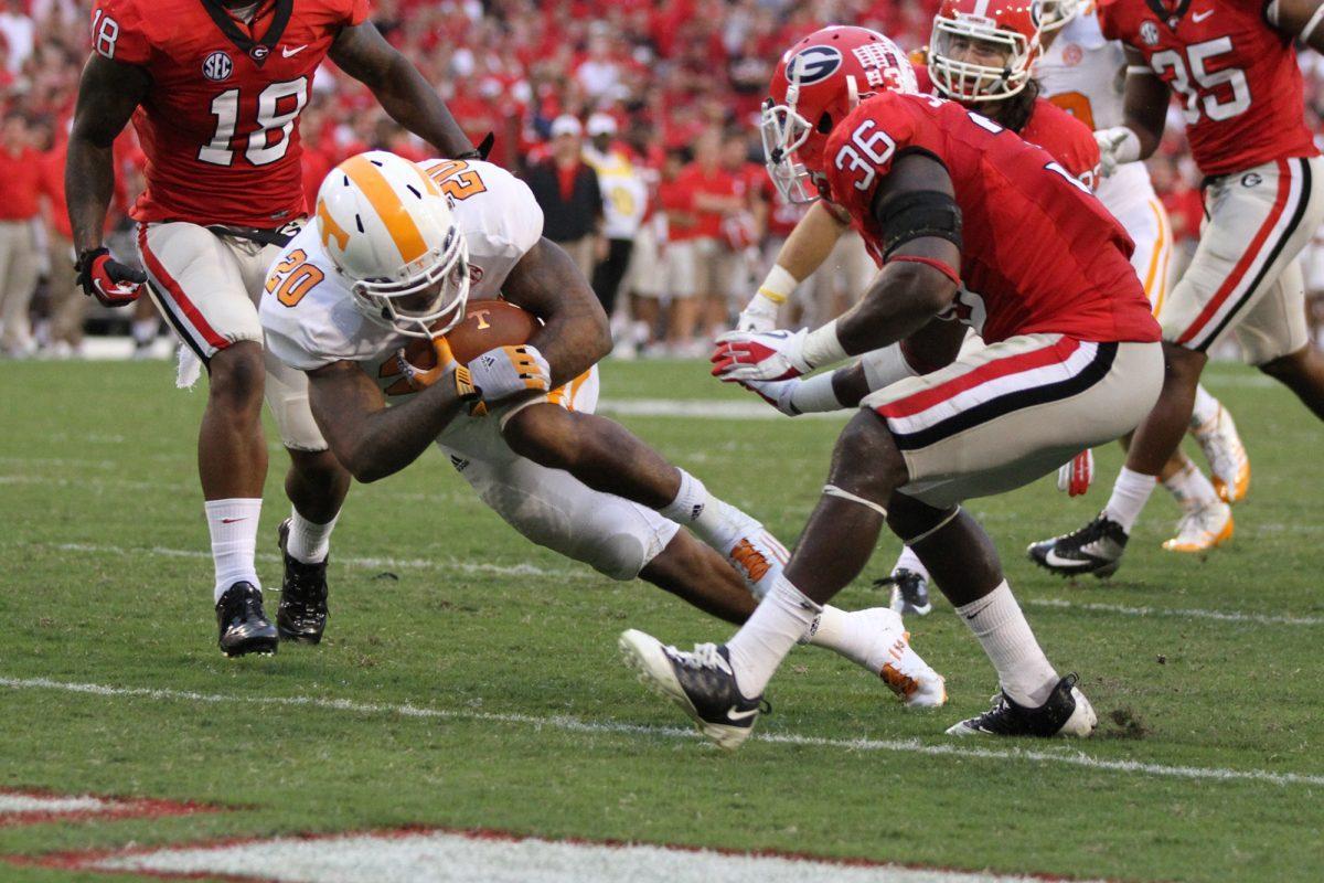 Junior tailback Raijon Neal maneuvers into the endzone past a Georgia defender during the Georgia game on Sept. 29.