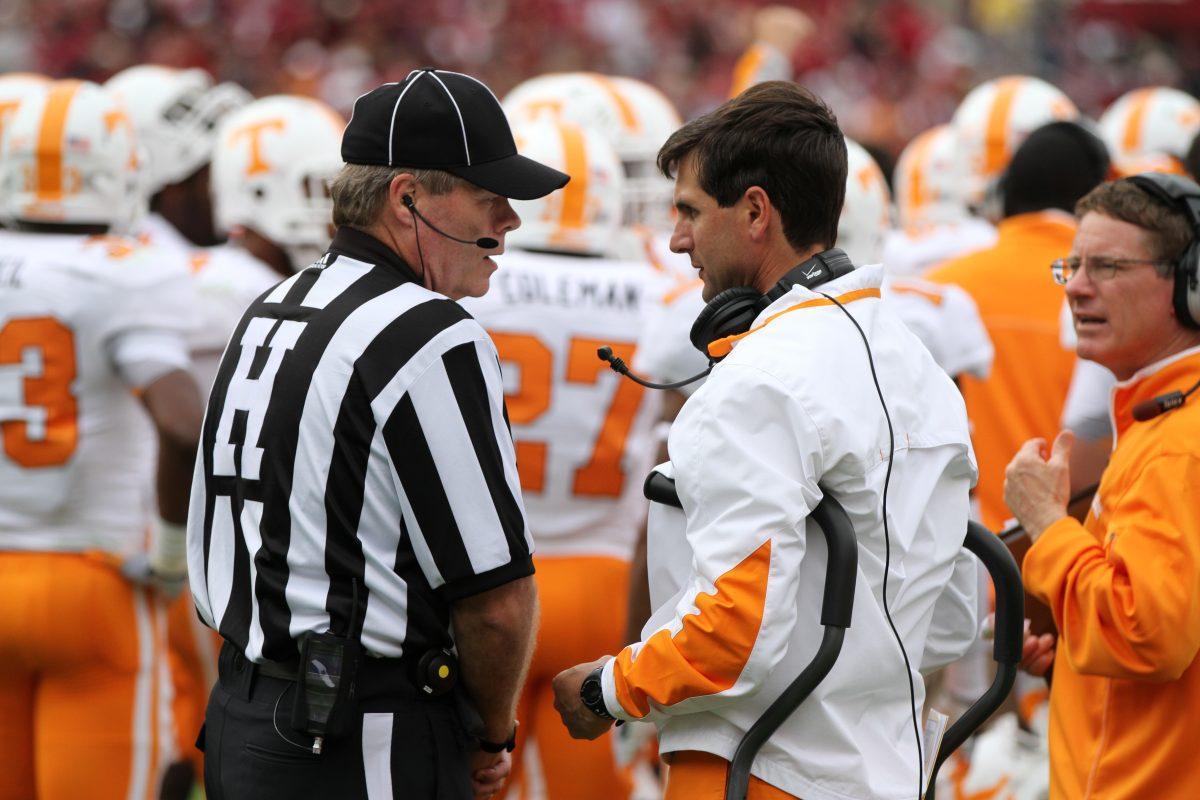 Derek Dooley speaking with an offical during Saturday's game at South Carolina