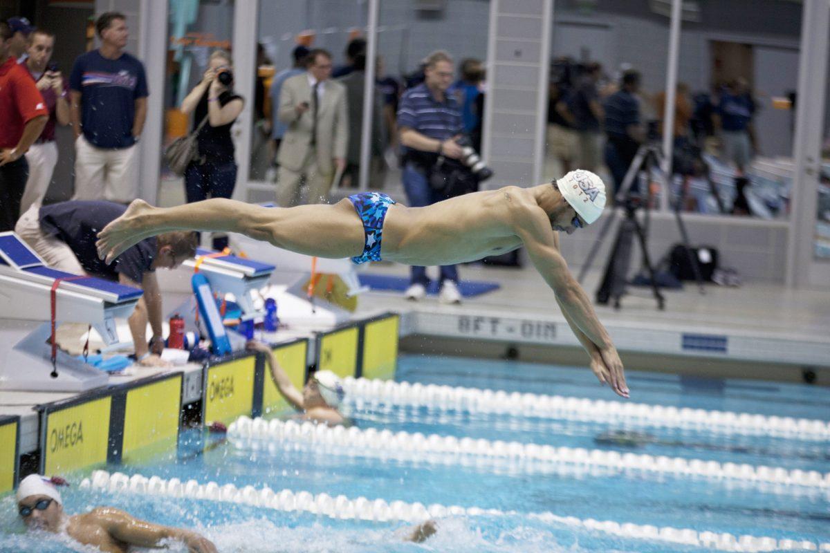 Davis Tarwater dives into the pool during the USA olympics practice on July 12.