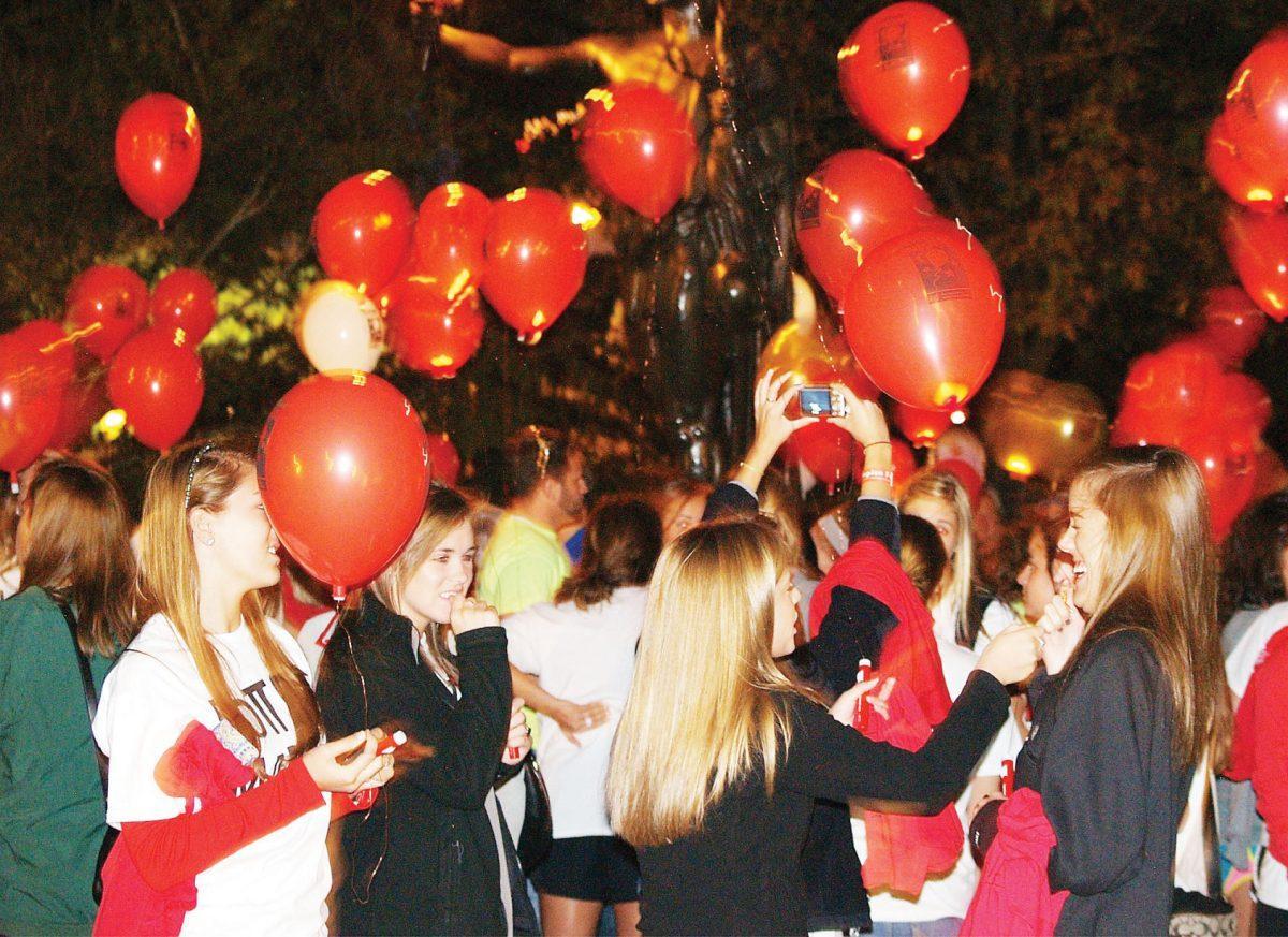 Girls from the Alpha Omicron Pi sorority gather at the "Light the Night" on Friday, Oct. 22, 2011, to walk in memory of Marla Rose Angotti, a member of the sorority who passed away due to leukemia.